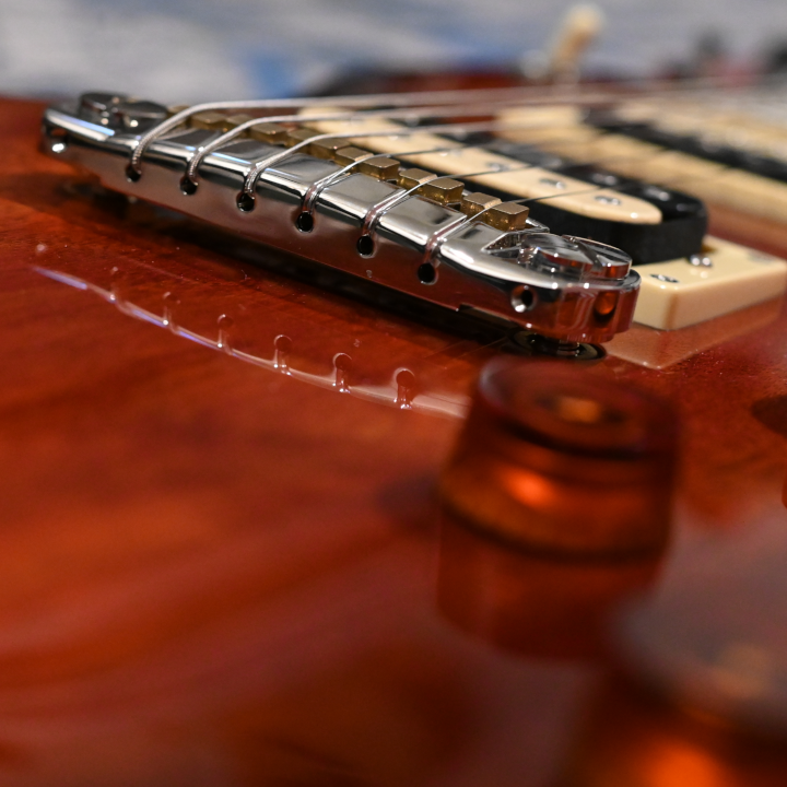 Closeup shot of the bridge of an electric guitar